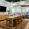 Spacious and well lit clubroom with seating and a library with an upstairs area for private studying.