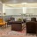 Spacious and well lit clubroom with seating and a library with an upstairs area for private studying.