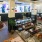 Spacious and well lit clubroom with seating and a library with an upstairs area for private studying.