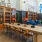 Spacious and well lit clubroom with seating and a library with an upstairs area for private studying.