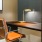 A large and well lit private study room with a large long table