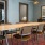 A large and well lit private study room with a large long table