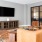 Large private area with couches and a tv 