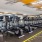 Large fitness center with cardio and weight lifting equipment.