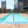 Spacious sparkling pool with sundecks and cabanas for lounging.	