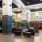 Spacious and well lit clubroom with seating and a library with an upstairs area for private studying.