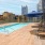 Spacious sparkling pool with sundecks and cabanas for lounging.