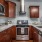 Kitchen with stainless appliances and a vent hood